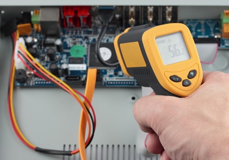 Infrared thermometer measuring a circuit board